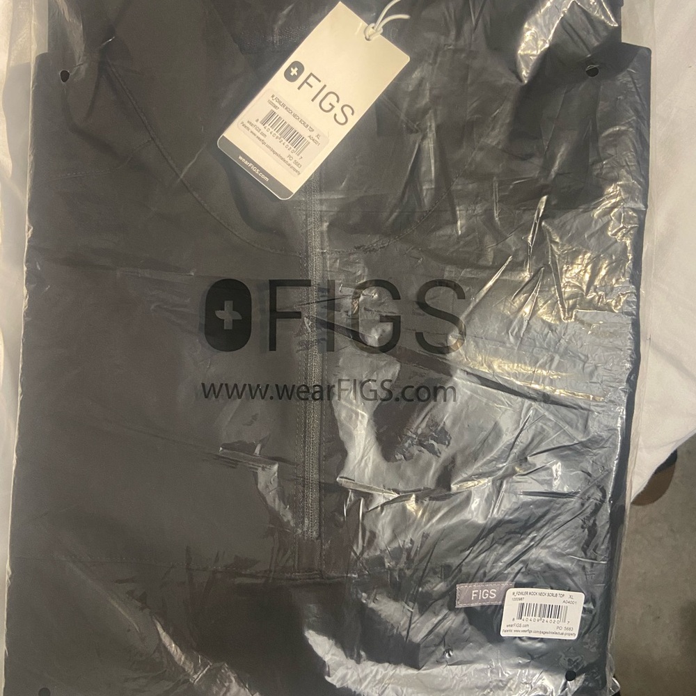 5 pieces  with tags figs male scrubs and scrub pants, never opened never worn.